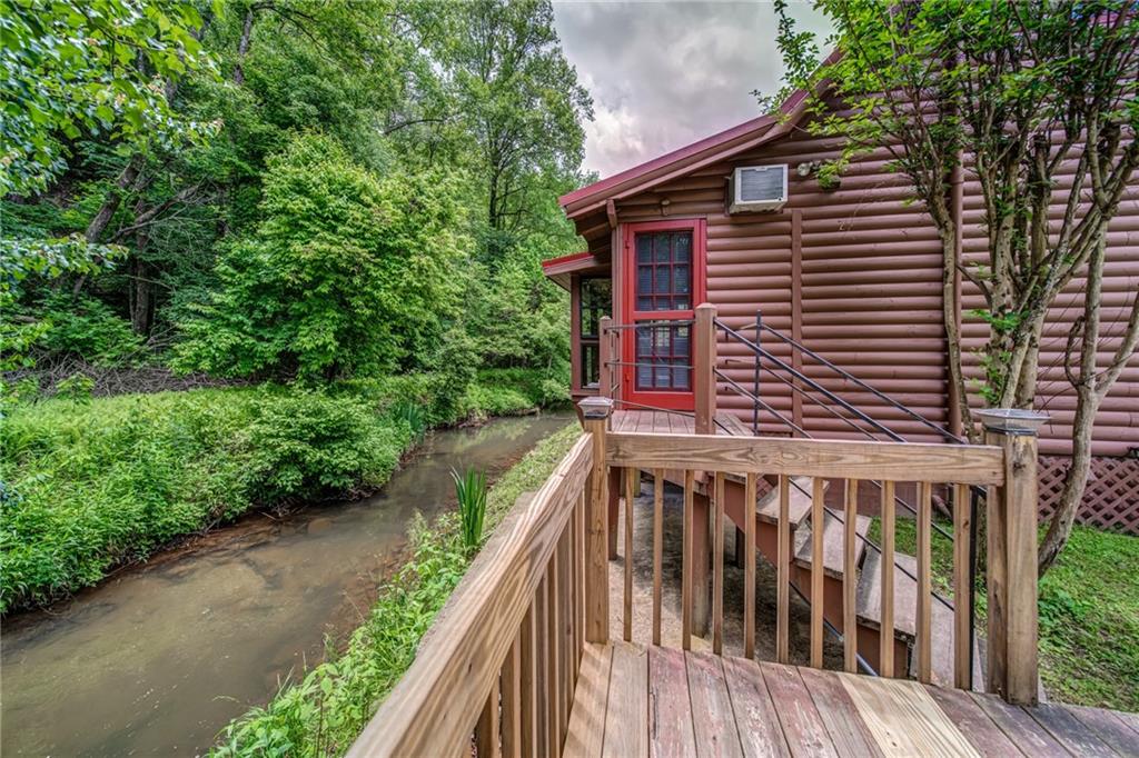 64 Bear Lake Drive Blue Ridge, GA 30513 - Photo 23 of 28 a view of a house with backyard and deck