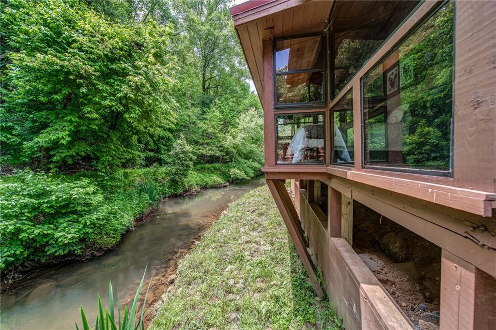 64 Bear Lake Drive Blue Ridge, GA 30513 - Photo 24 of 28 a view of a house with backyard and balcony