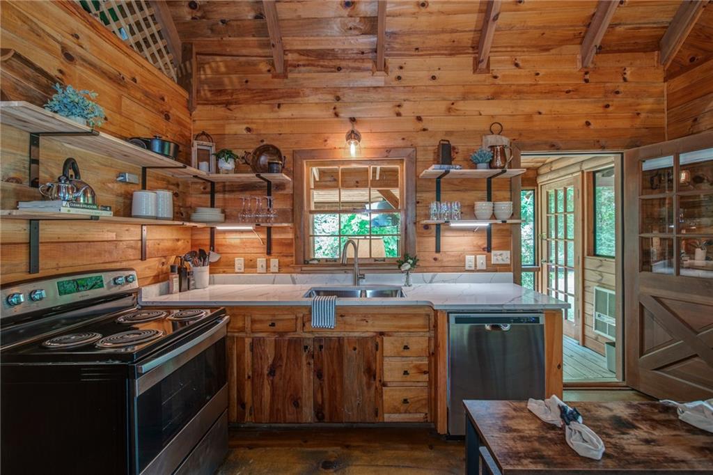 64 Bear Lake Drive Blue Ridge, GA 30513 - Photo 8 of 28 a kitchen with a stove and a sink