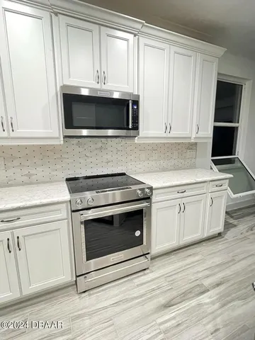 a kitchen with a stove and a sink