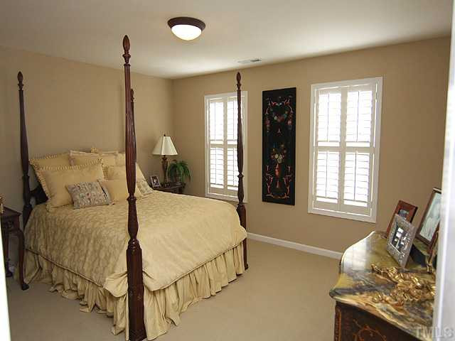 6105 Schaller Court Raleigh, NC 27617 - Photo 10 of 23 Second bedroom upstairs, features wallk-in closet and plantation shutters. Bedroom