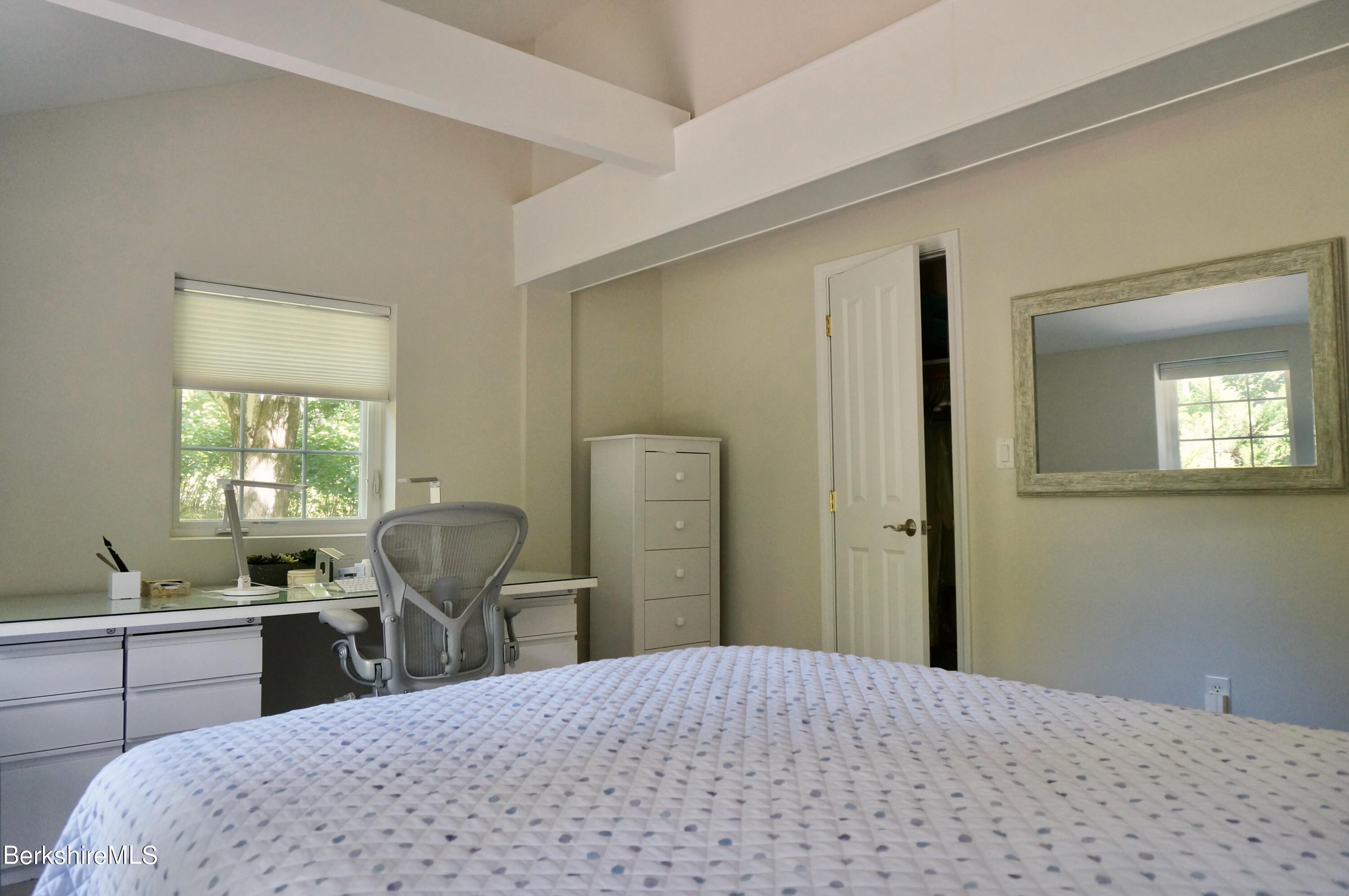 72 Interlaken Road, Unit 1 West Stockbridge, MA 01266 - Photo 11 of 16 a bedroom with a bed and wooden floor