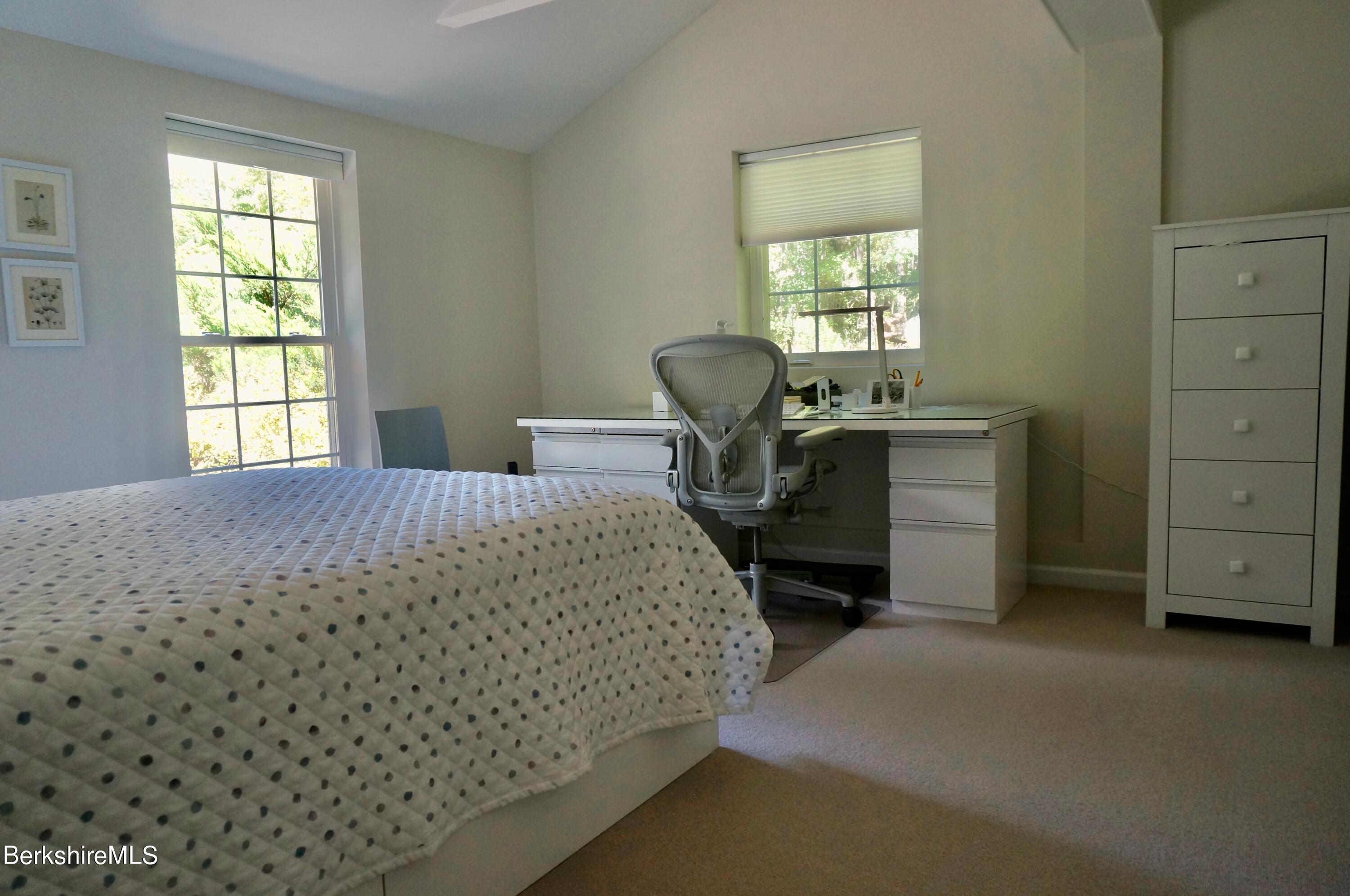 72 Interlaken Road, Unit 1 West Stockbridge, MA 01266 - Photo 12 of 16 a bedroom with a bed closet and a window