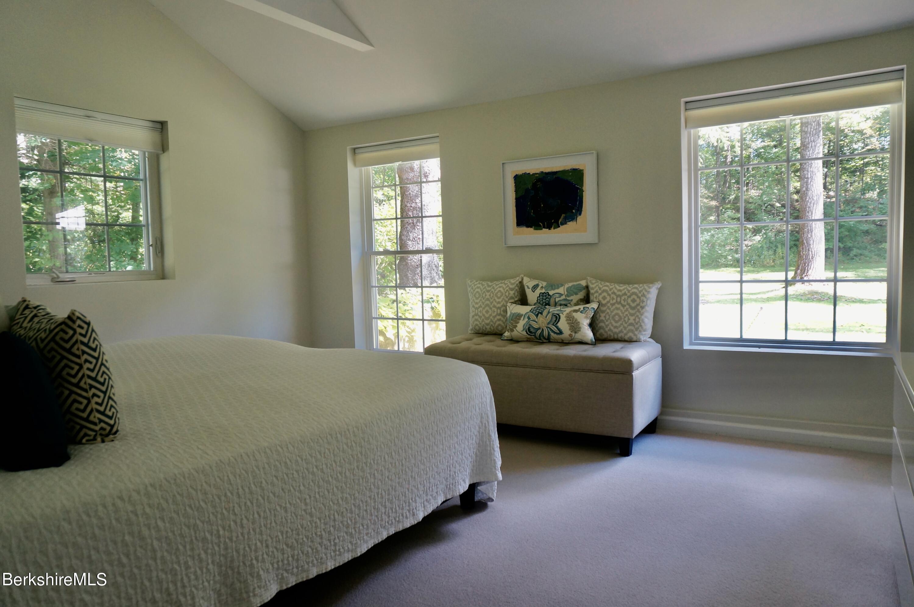 72 Interlaken Road, Unit 1 West Stockbridge, MA 01266 - Photo 13 of 16 a bedroom with a bed furniture and a window