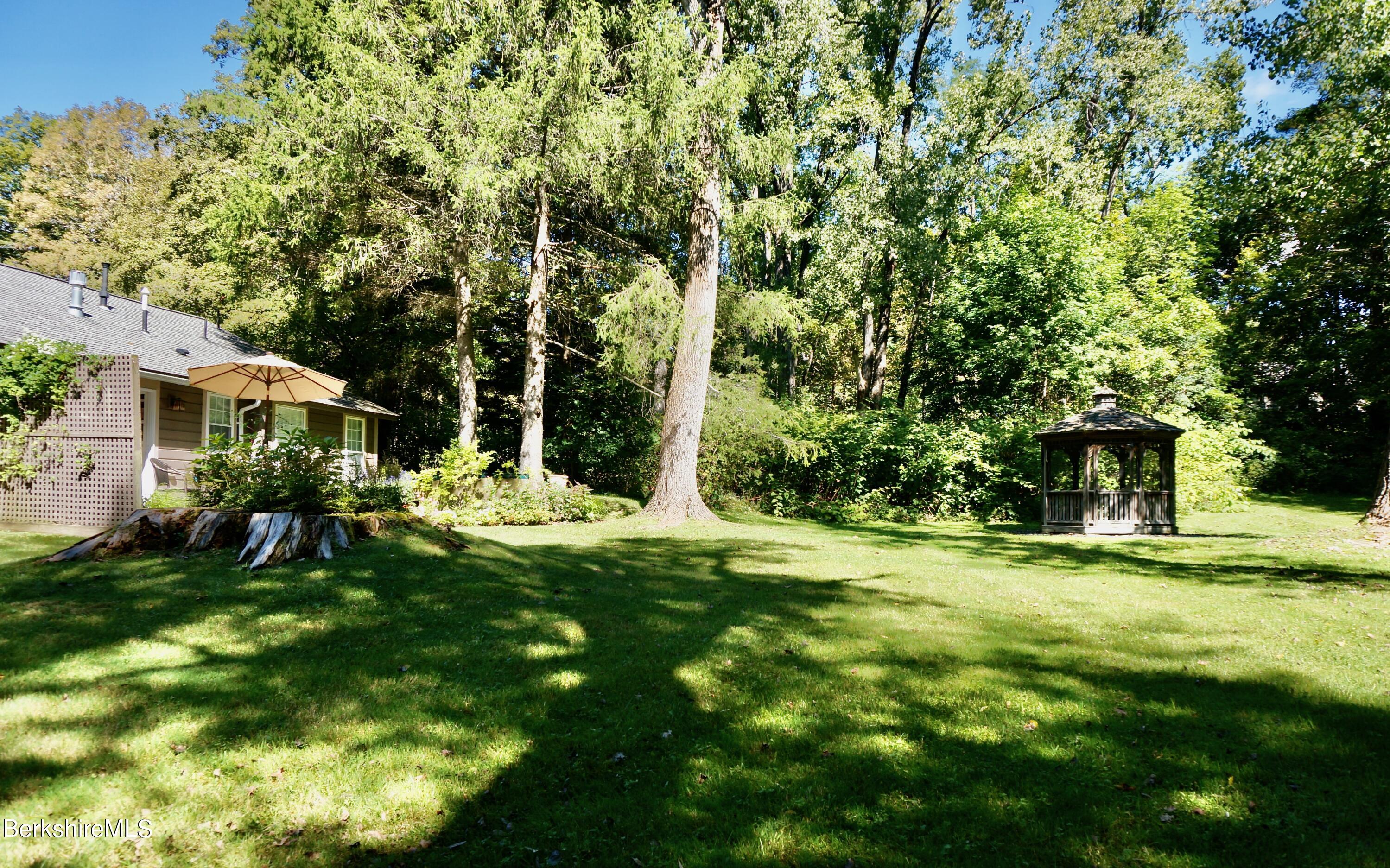 72 Interlaken Road, Unit 1 West Stockbridge, MA 01266 - Photo 15 of 16 a view of a house with a yard