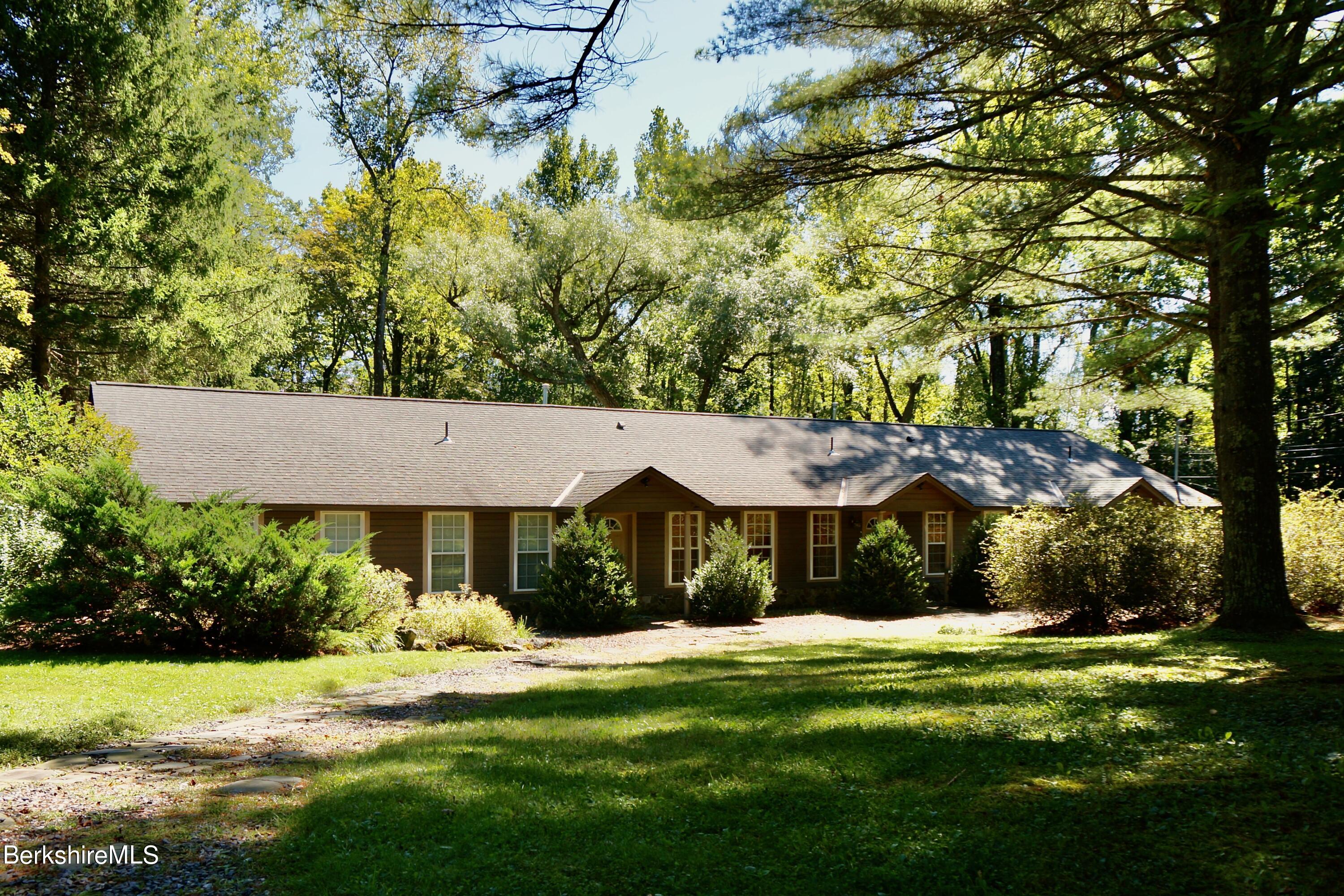 72 Interlaken Road, Unit 1 West Stockbridge, MA 01266 - Photo 2 of 16 a view of house with garden space and trees