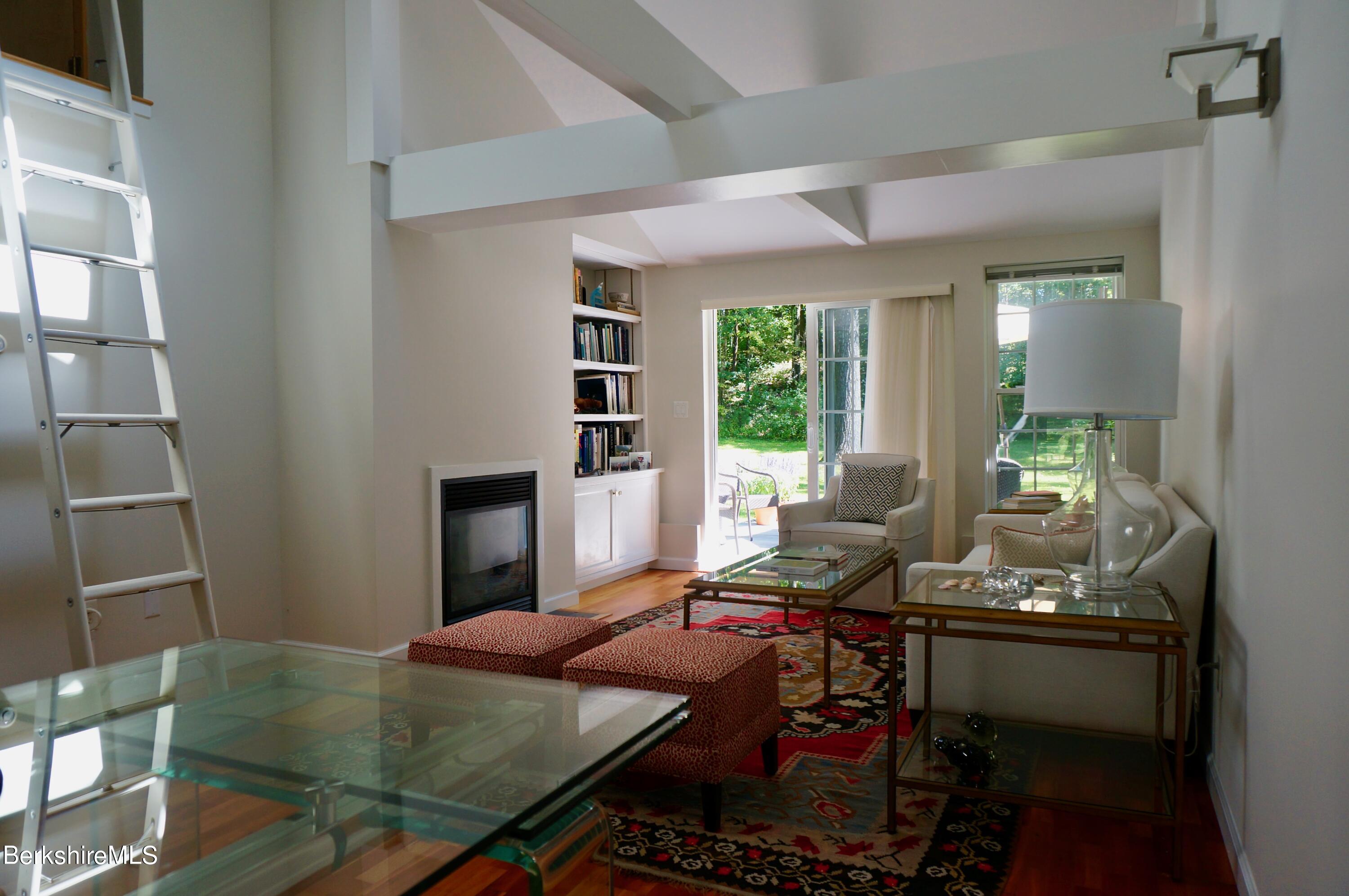 72 Interlaken Road, Unit 1 West Stockbridge, MA 01266 - Photo 4 of 16 a room with furniture and a wooden floor