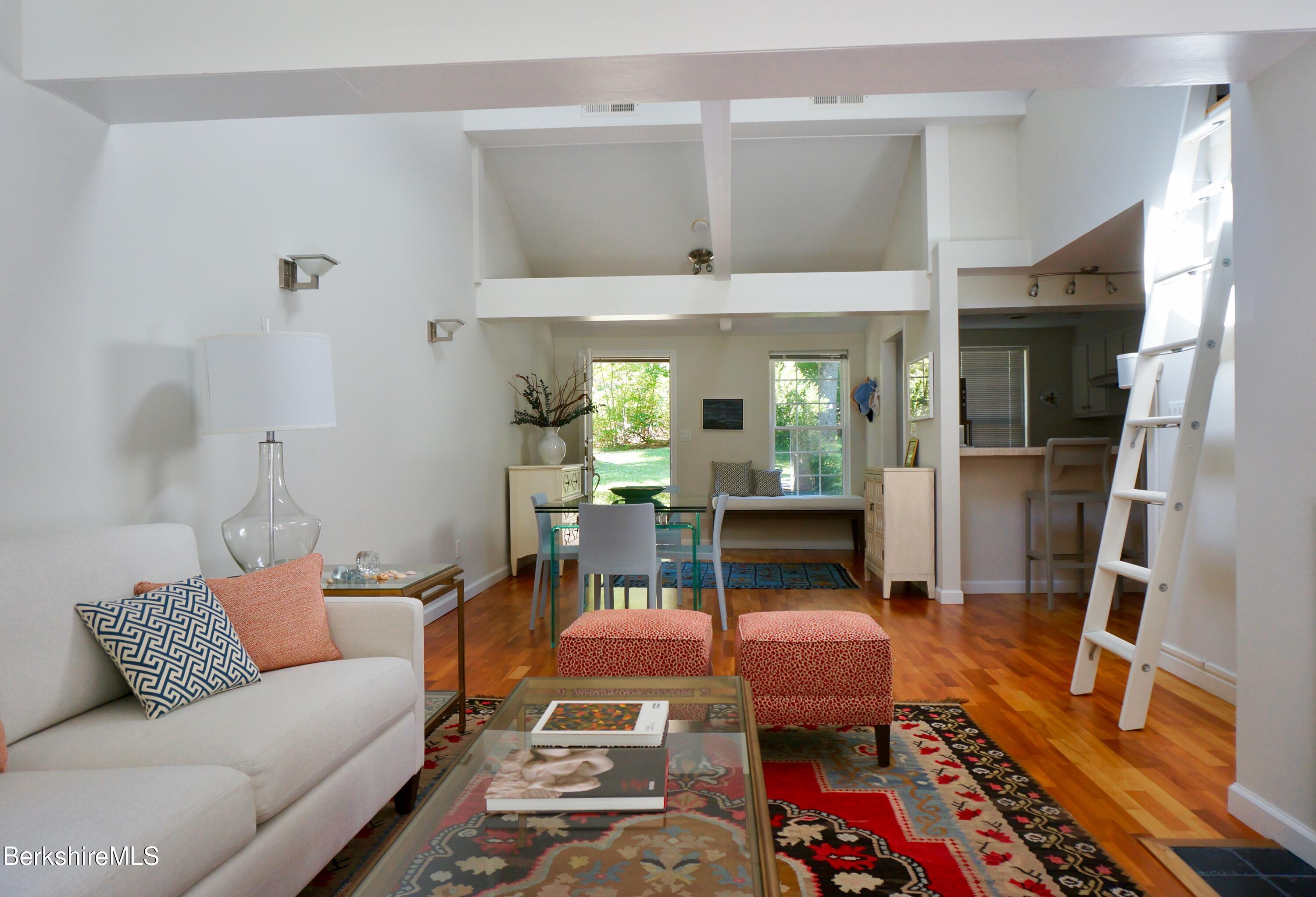 72 Interlaken Road, Unit 1 West Stockbridge, MA 01266 - Photo 5 of 16 a living room with furniture and a table