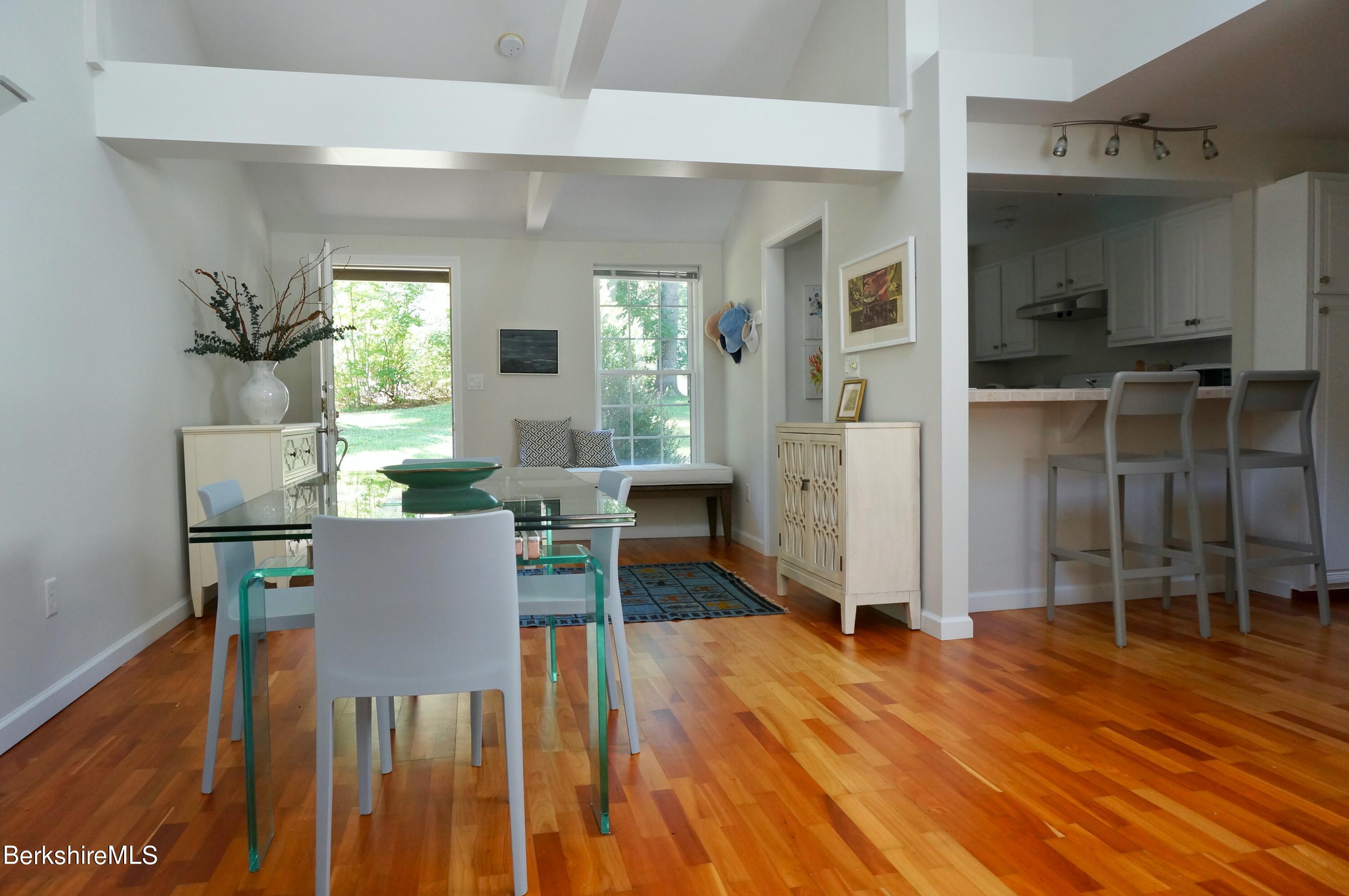 72 Interlaken Road, Unit 1 West Stockbridge, MA 01266 - Photo 6 of 16 a dining room with furniture and wooden floor