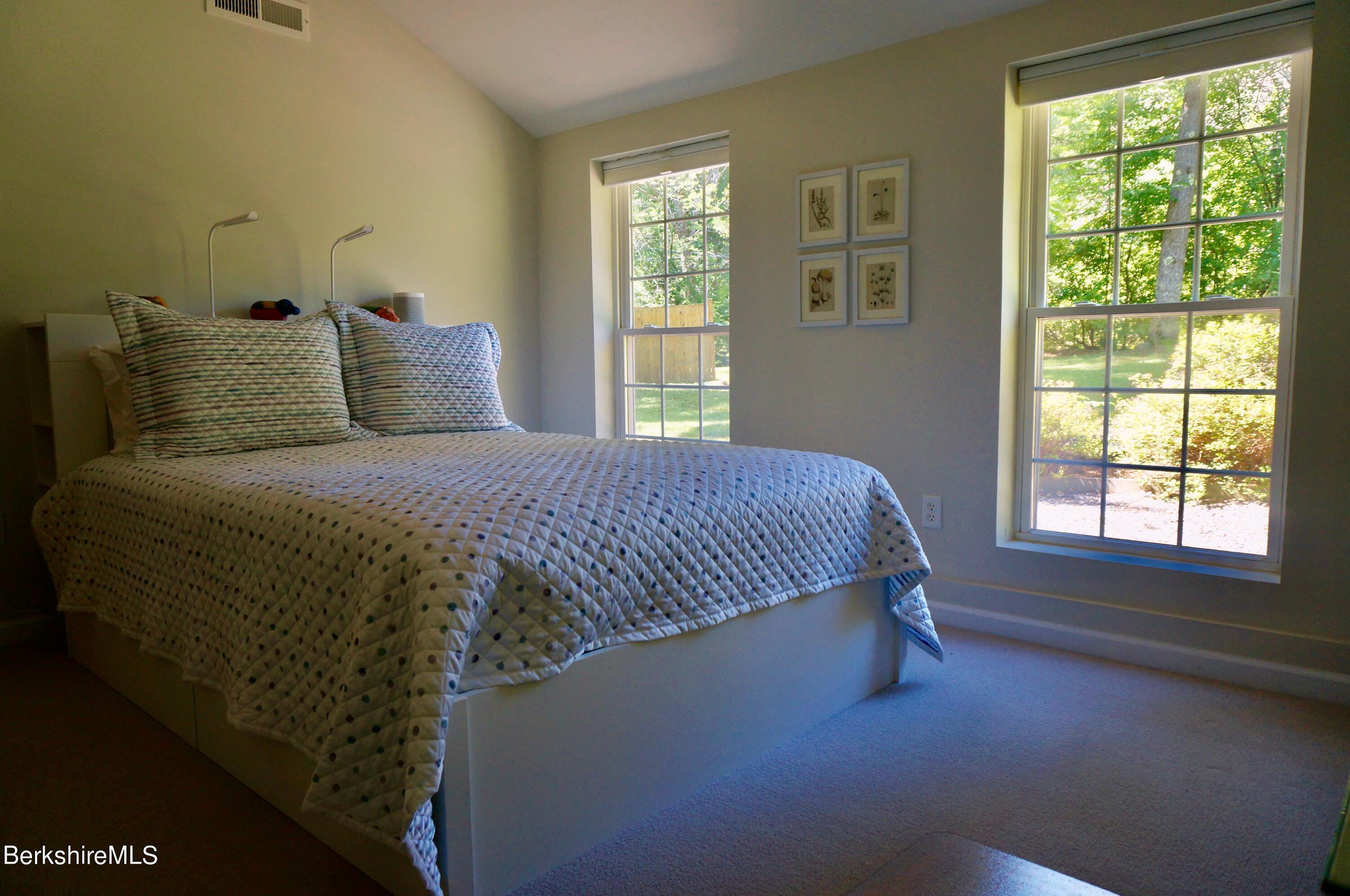 72 Interlaken Road, Unit 1 West Stockbridge, MA 01266 - Photo 10 of 16 a bedroom with a bed and window