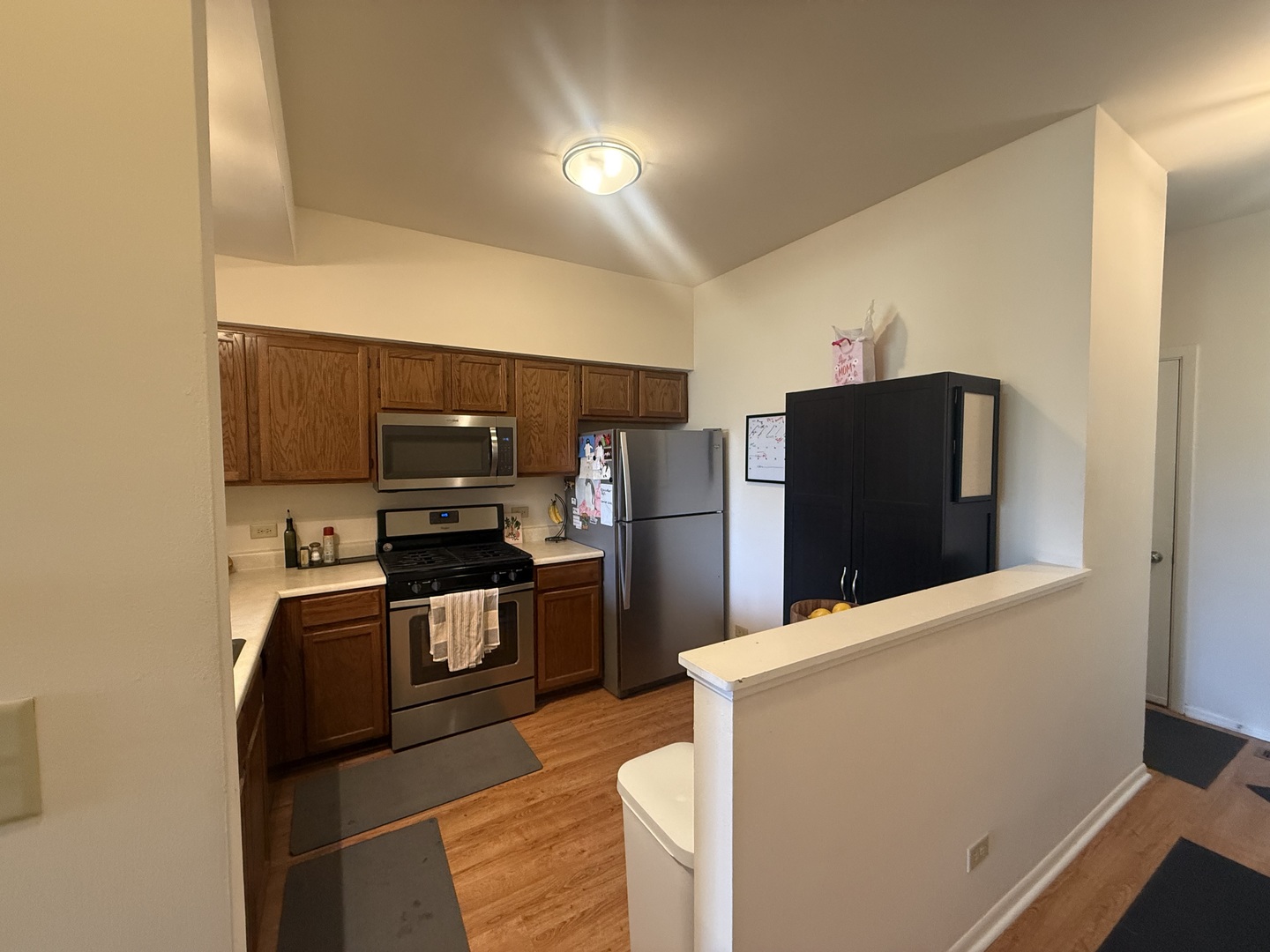 348 Fallbrook Court Schaumburg, IL 60107 - Photo 5 of 21 a kitchen with stainless steel appliances a refrigerator and a stove