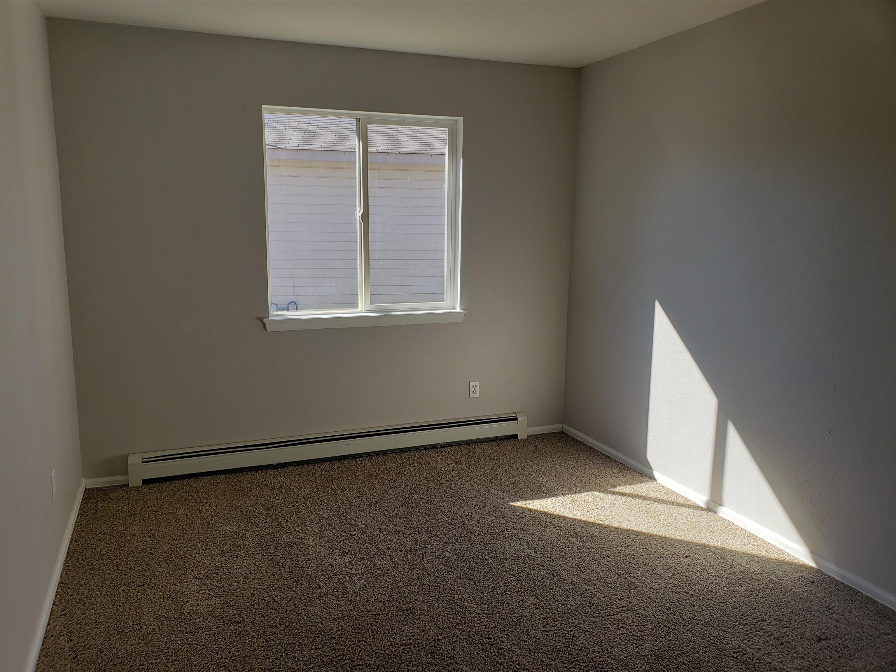 515 Quebec Court Fruita, CO 81521 - Photo 14 of 16 an empty room with windows