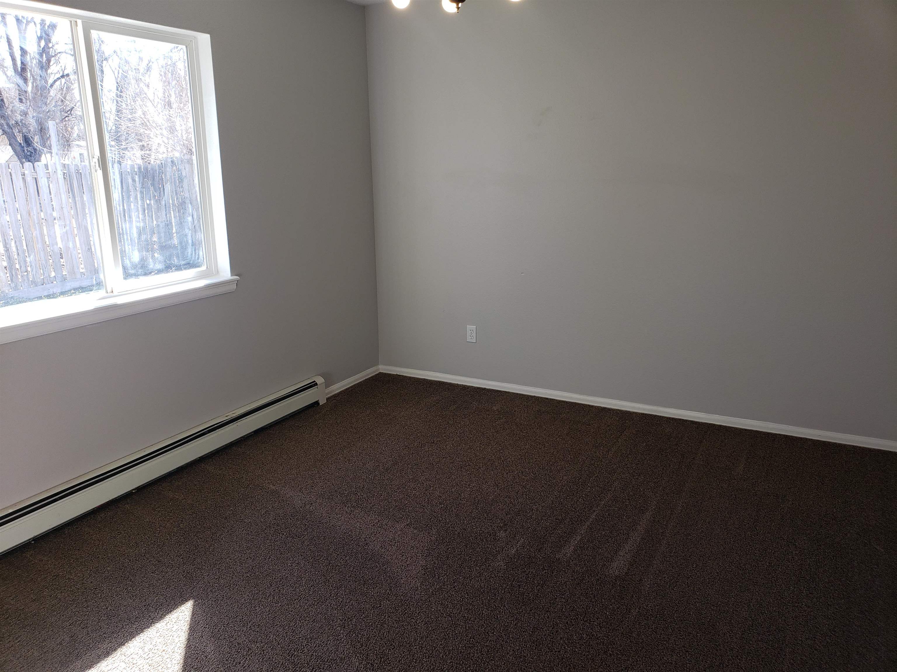515 Quebec Court Fruita, CO 81521 - Photo 15 of 16 an empty room with a window