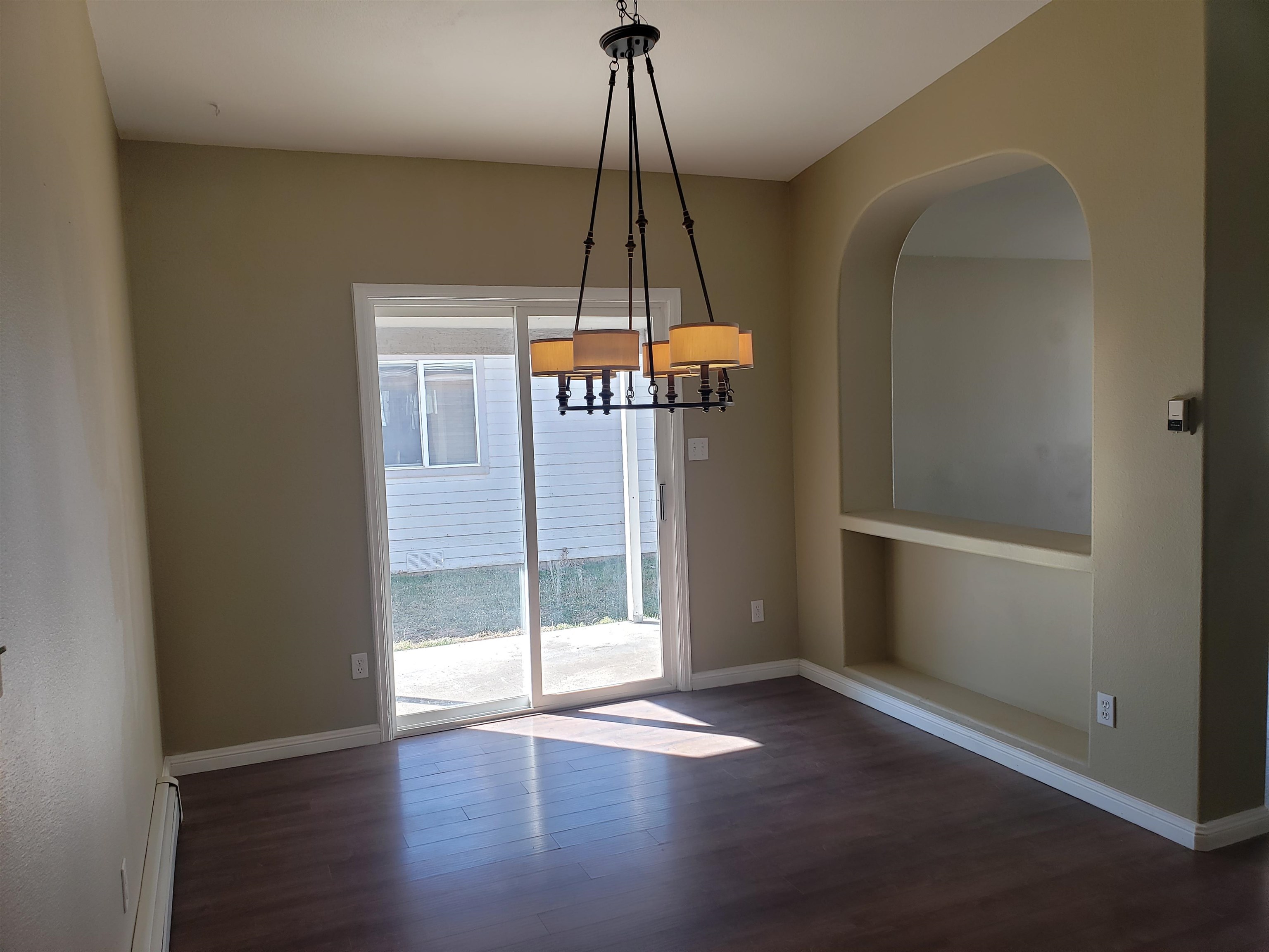 515 Quebec Court Fruita, CO 81521 - Photo 4 of 16 a view of a room with wooden floor and white walls