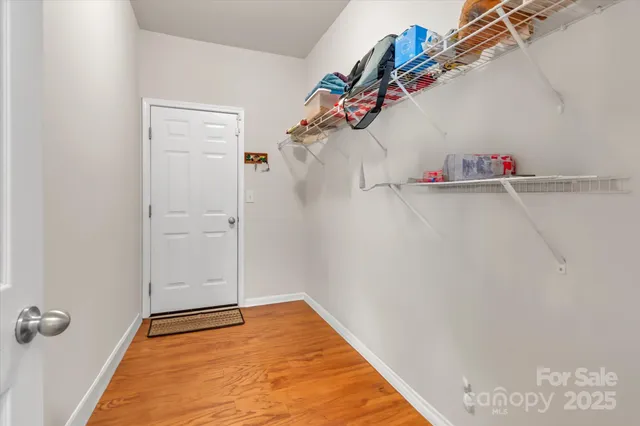 a view of a room with racks on the wall