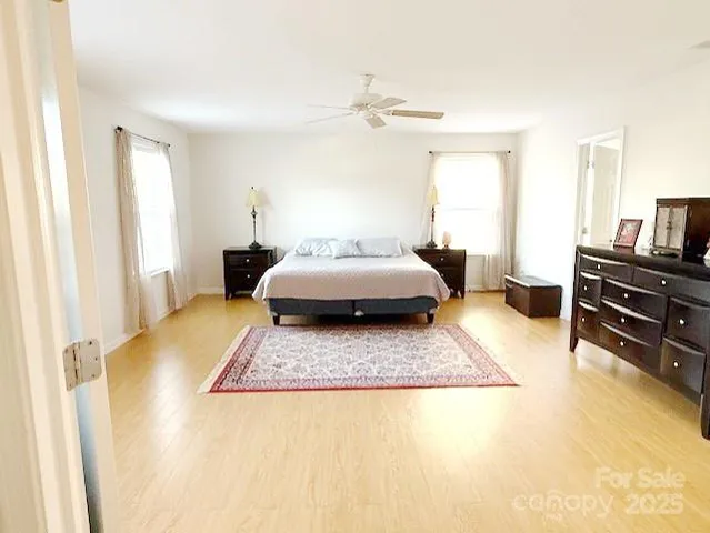 a living room with a bed furniture and a window