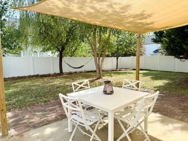 a view of an outdoor space with dining table and chair