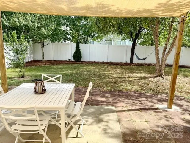 a view of a yard with furniture