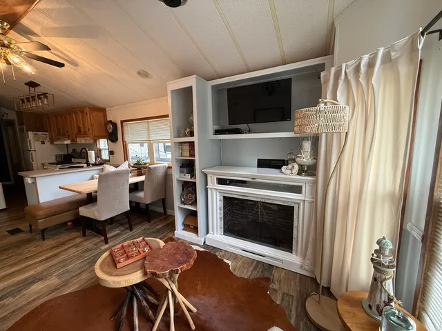 a kitchen with stainless steel appliances a stove a microwave a sink and a refrigerator