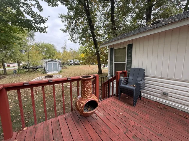 a view of balcony with couch and wooden floor