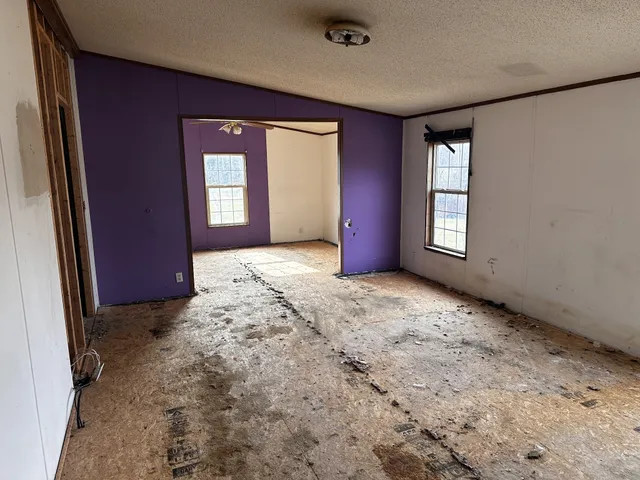 a bathroom with a shower and a glass door