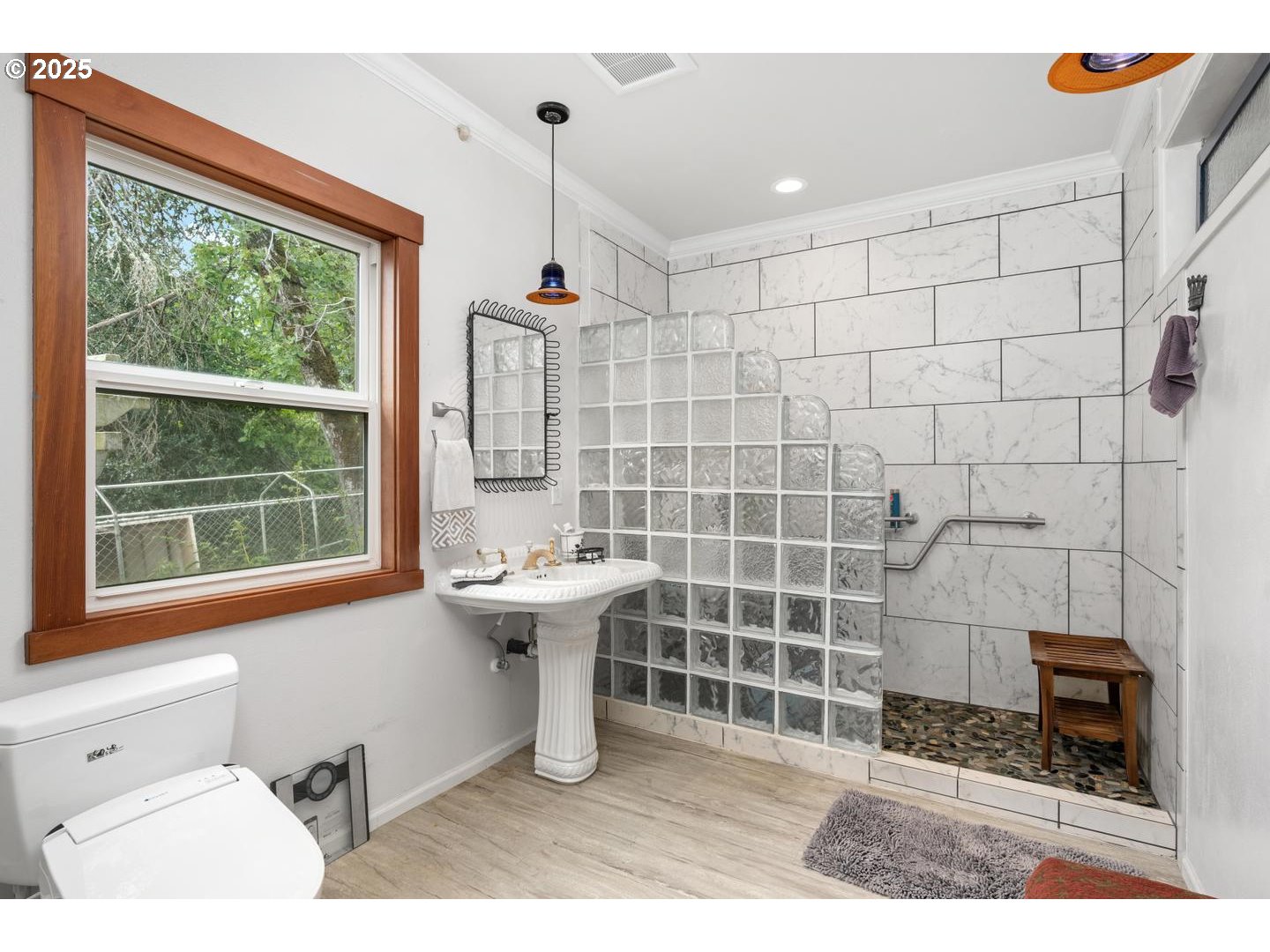 8970 Southeast Kingswood Way Damascus, OR 97089 - Photo 16 of 42 a bathroom with a sink a toilet and shower