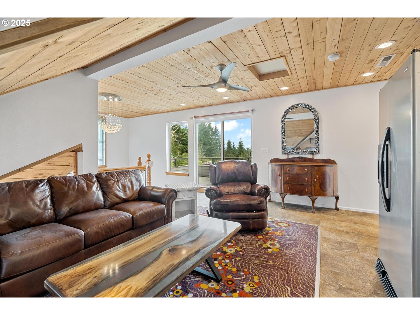 8970 Southeast Kingswood Way Damascus, OR 97089 - Photo 21 of 42 a living room with furniture and a flat screen tv