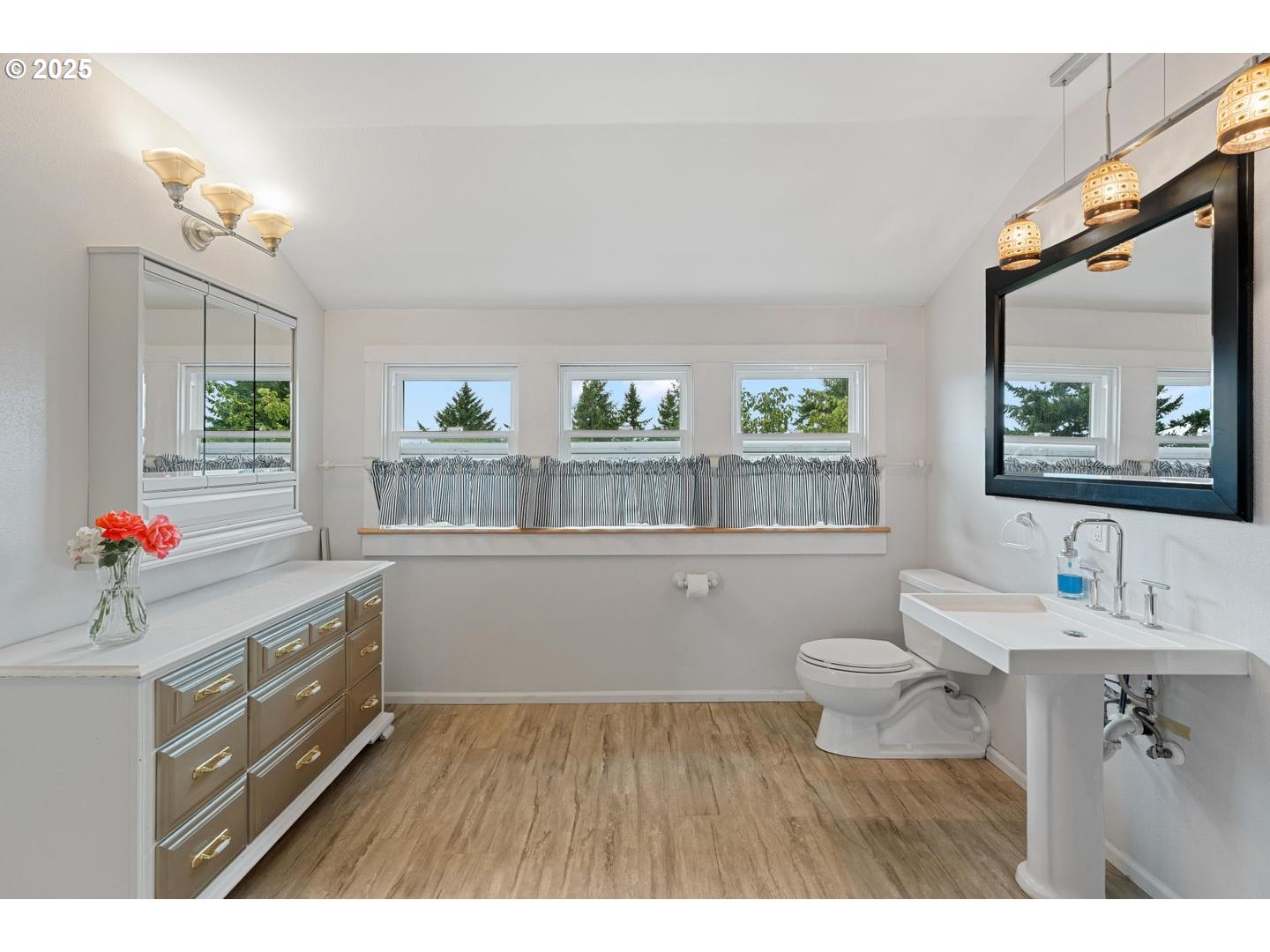 8970 Southeast Kingswood Way Damascus, OR 97089 - Photo 24 of 42 a kitchen with a sink cabinets and wooden floor