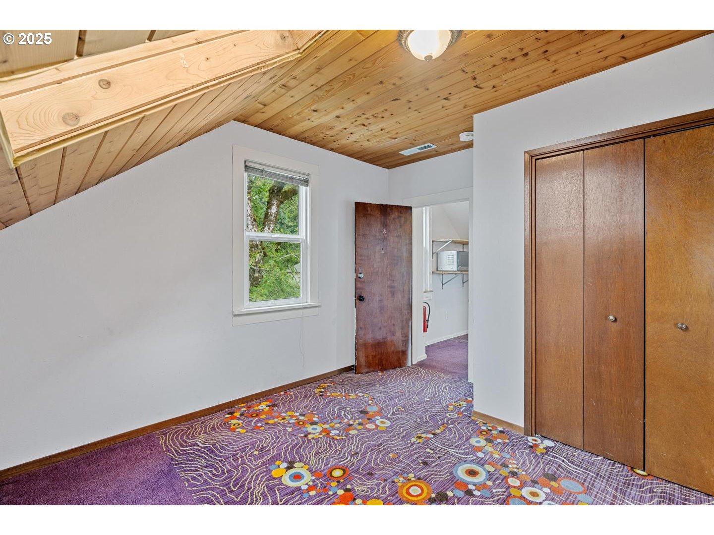 8970 Southeast Kingswood Way Damascus, OR 97089 - Photo 27 of 42 a view of a big room with wooden floor and windows