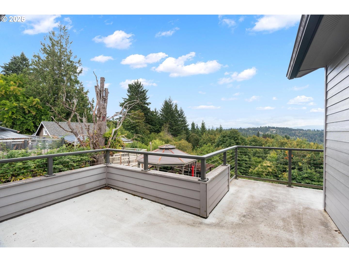 8970 Southeast Kingswood Way Damascus, OR 97089 - Photo 28 of 42 a view of roof deck with couches and wooden floor