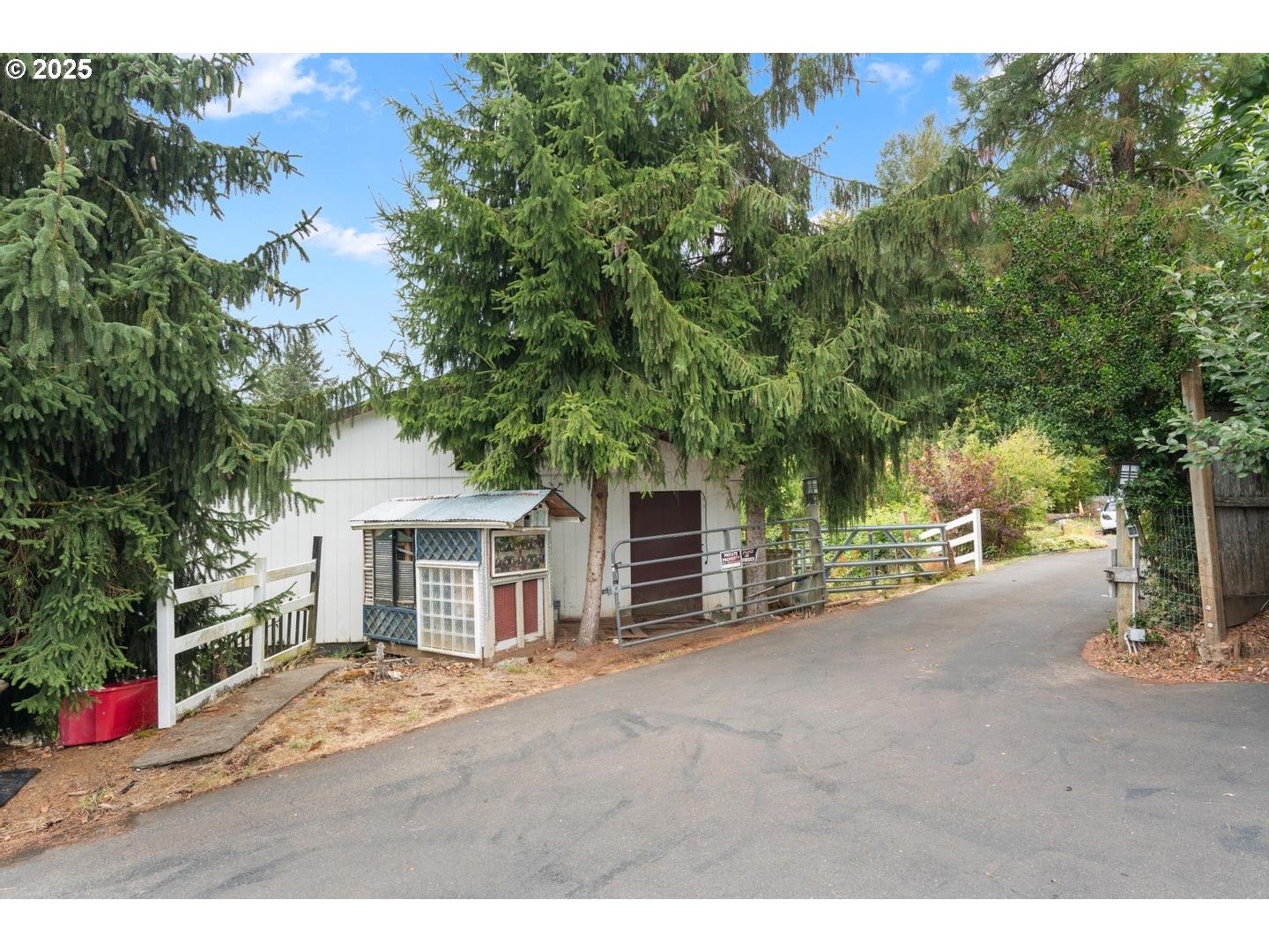 8970 Southeast Kingswood Way Damascus, OR 97089 - Photo 41 of 42 a view of a house with a street