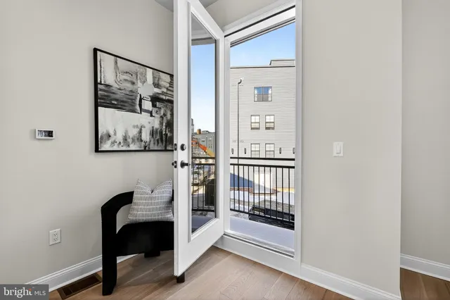 a view of a hallway with paintings on the wall