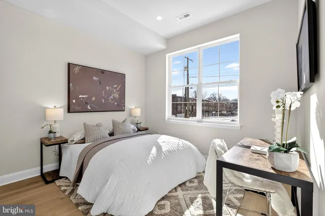 a view of a hallway with a wooden floor