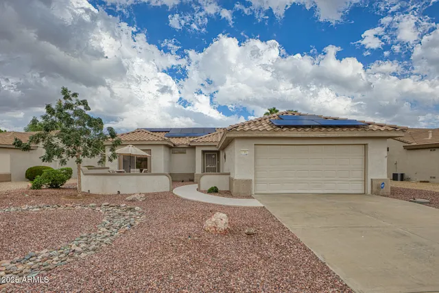 front view of a house with a yard