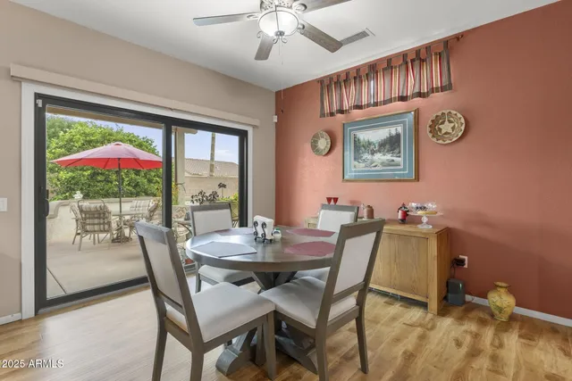 a kitchen with stainless steel appliances granite countertop a refrigerator sink and stove