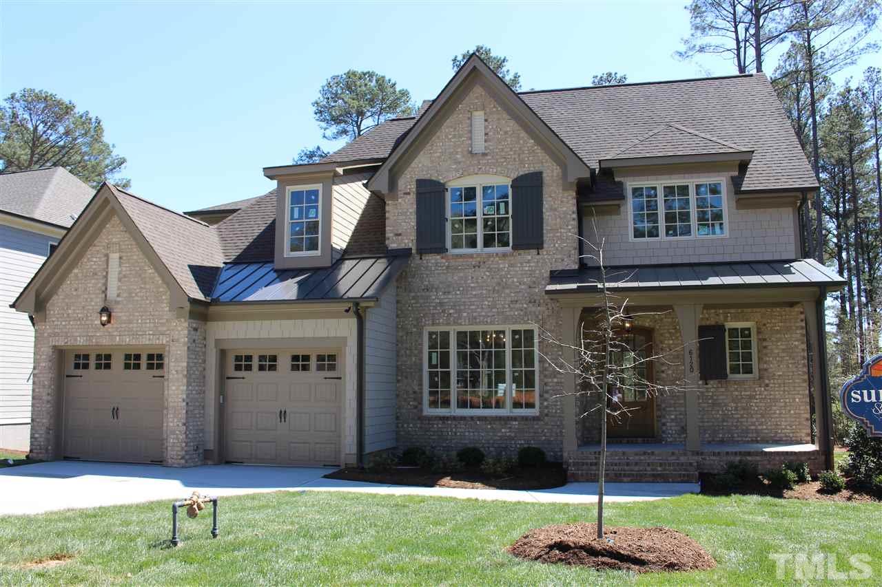 6120 Ponderosa Road Raleigh, NC 27612 - Photo 1 of 25 a front view of a house with a yard