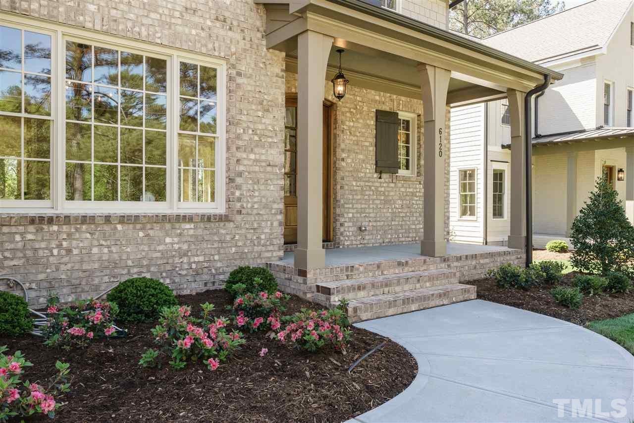 6120 Ponderosa Road Raleigh, NC 27612 - Photo 2 of 25 a view of a house with a small garden