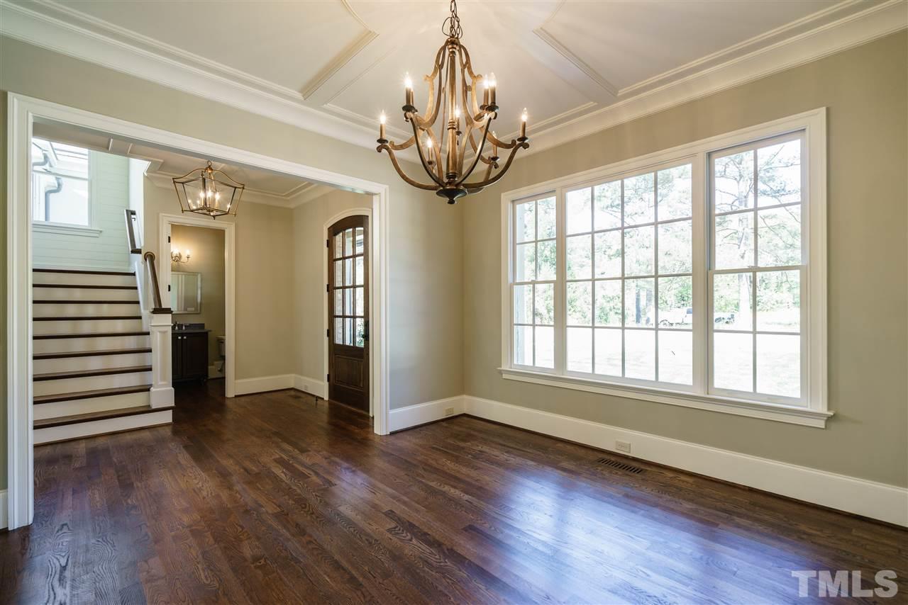 6120 Ponderosa Road Raleigh, NC 27612 - Photo 11 of 25 a view of empty room with wooden floor and fan