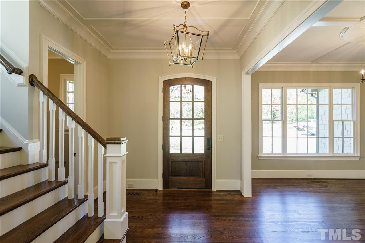 6120 Ponderosa Road Raleigh, NC 27612 - Photo 12 of 25 a view of an entryway with wooden floor and door