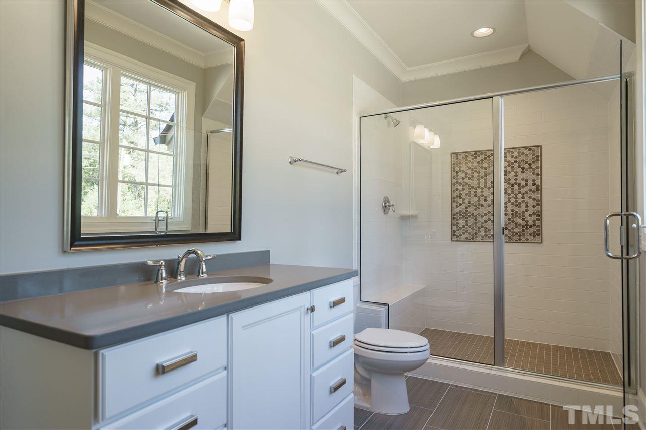 6120 Ponderosa Road Raleigh, NC 27612 - Photo 18 of 25 a bathroom with a granite countertop sink toilet and shower