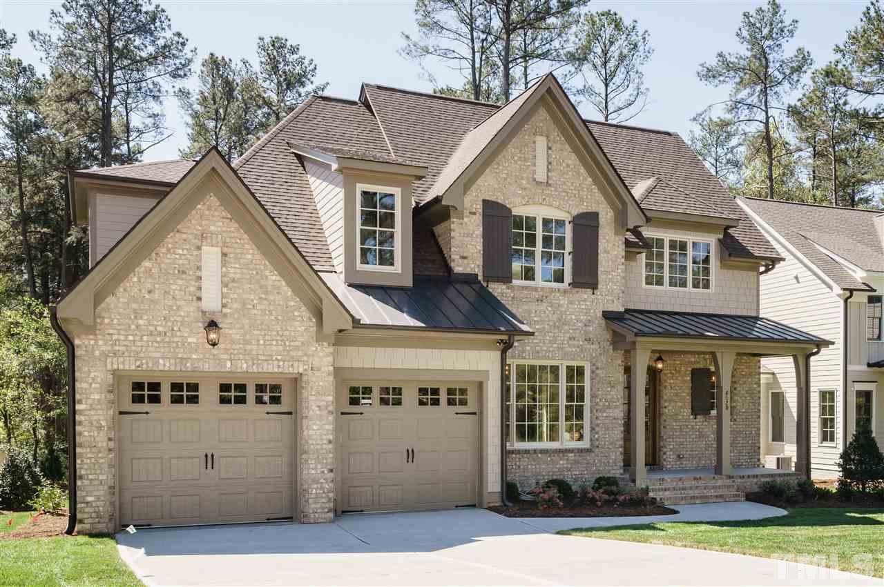 6120 Ponderosa Road Raleigh, NC 27612 - Photo 3 of 25 a front view of a house with a yard