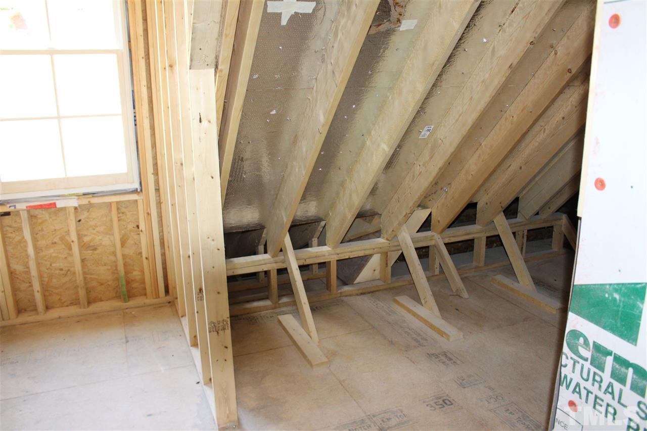 6120 Ponderosa Road Raleigh, NC 27612 - Photo 22 of 25 a view of an empty room with a window