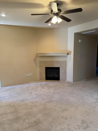 a view of a livingroom with a ceiling fan