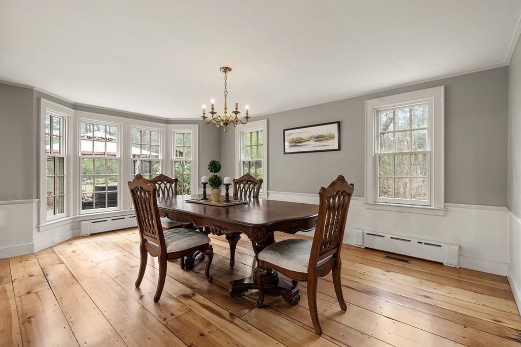 92 Goodnow Road Sudbury, MA 01776 - Photo 11 of 37 a view of a dining room with furniture wooden floor and chandelier