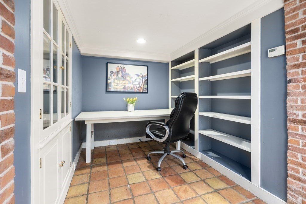 92 Goodnow Road Sudbury, MA 01776 - Photo 13 of 37 a view of a workspace with furniture and a window