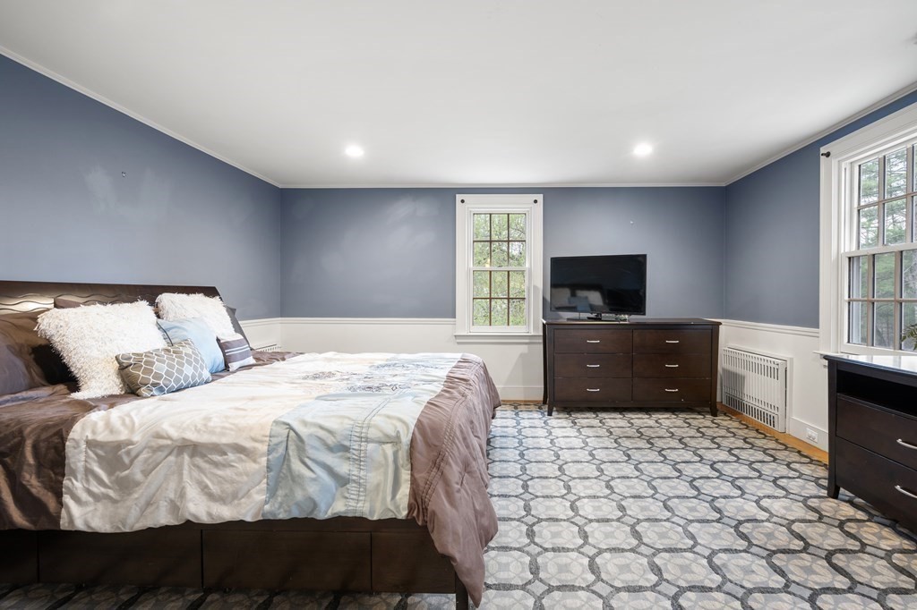 92 Goodnow Road Sudbury, MA 01776 - Photo 16 of 37 a bedroom with a bed and a flat screen tv