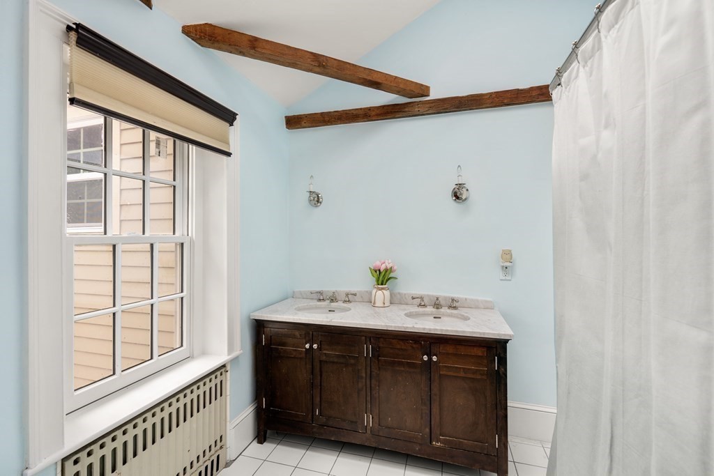 92 Goodnow Road Sudbury, MA 01776 - Photo 20 of 37 a bathroom with a sink vanity and a mirror