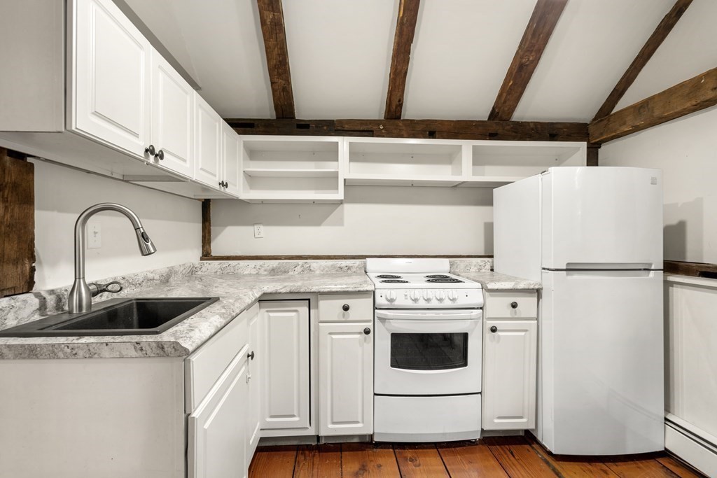 92 Goodnow Road Sudbury, MA 01776 - Photo 22 of 37 a view of kitchen with sink and refrigerator