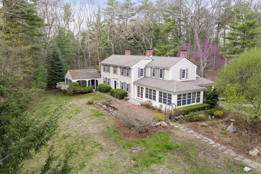 92 Goodnow Road Sudbury, MA 01776 - Photo 27 of 37 a view of a house with a yard and hanging chair