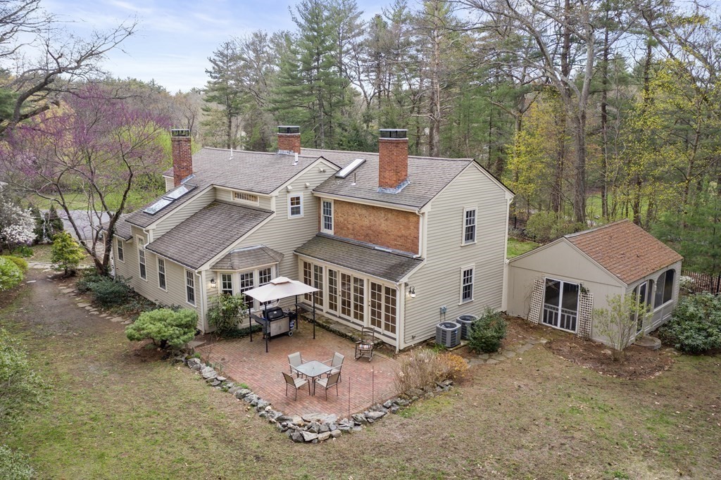 92 Goodnow Road Sudbury, MA 01776 - Photo 28 of 37 a front view of a house with a yard and garage